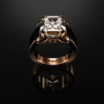 Spirit of Ecstasy ring in 18K rose gold with a square step-cut diamond